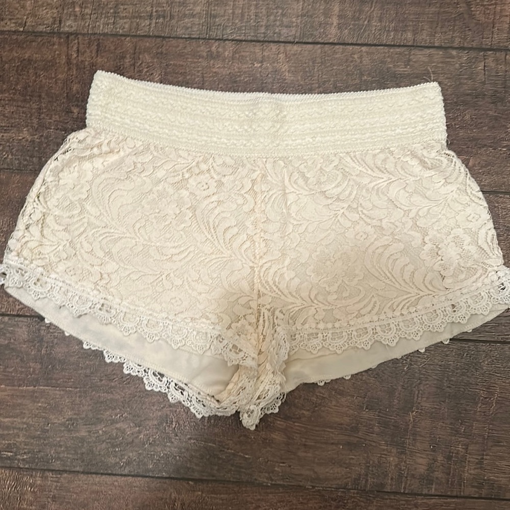 Ambiance Apparel crème colored woman’s shorts with floral lace